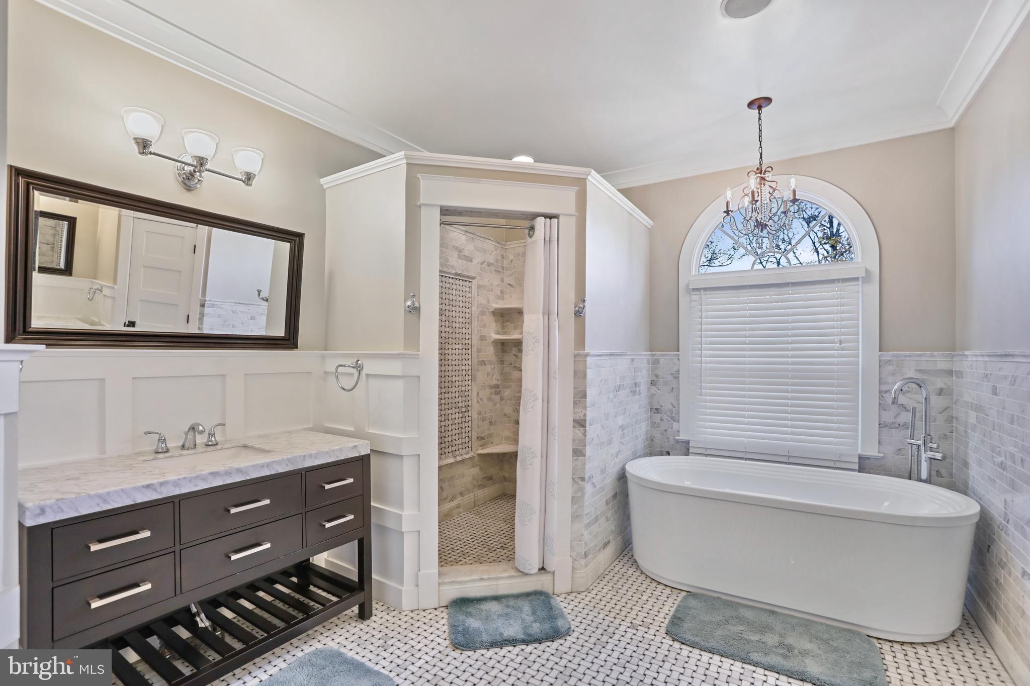 21490 Cedar Drive Sterling, VA 20164 - Photo 27 of 73 a bathroom with a granite countertop sink a toilet a mirror a bathtub and shower
