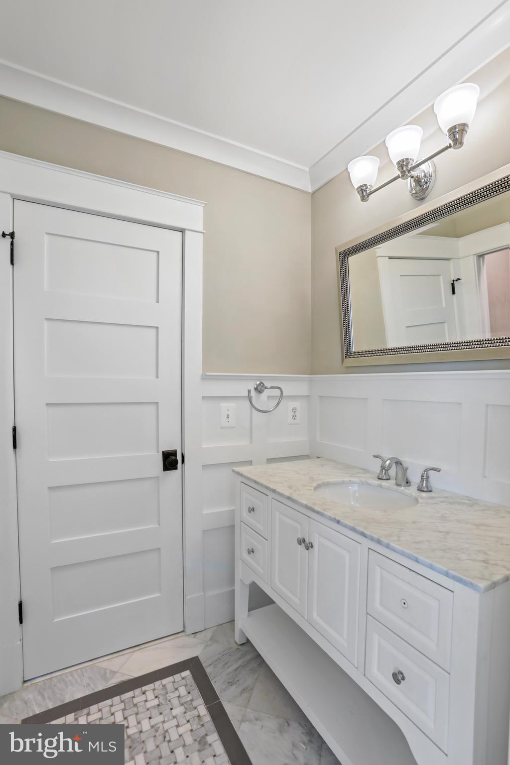 21490 Cedar Drive Sterling, VA 20164 - Photo 37 of 73 a bathroom with a sink a vanity and a mirror