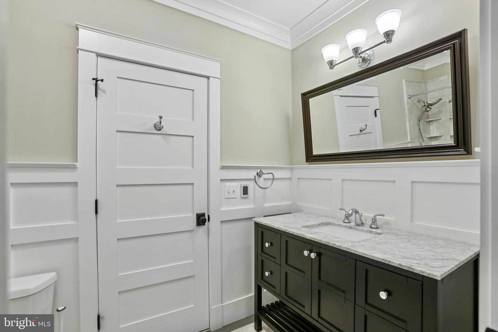 21490 Cedar Drive Sterling, VA 20164 - Photo 43 of 73 a bathroom with a sink vanity and mirror