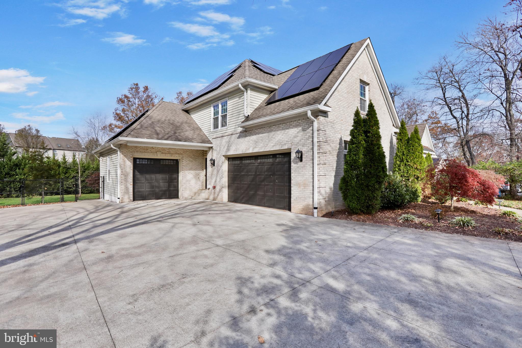 21490 Cedar Drive Sterling, VA 20164 - Photo 55 of 73 a view of a house with a yard and garage