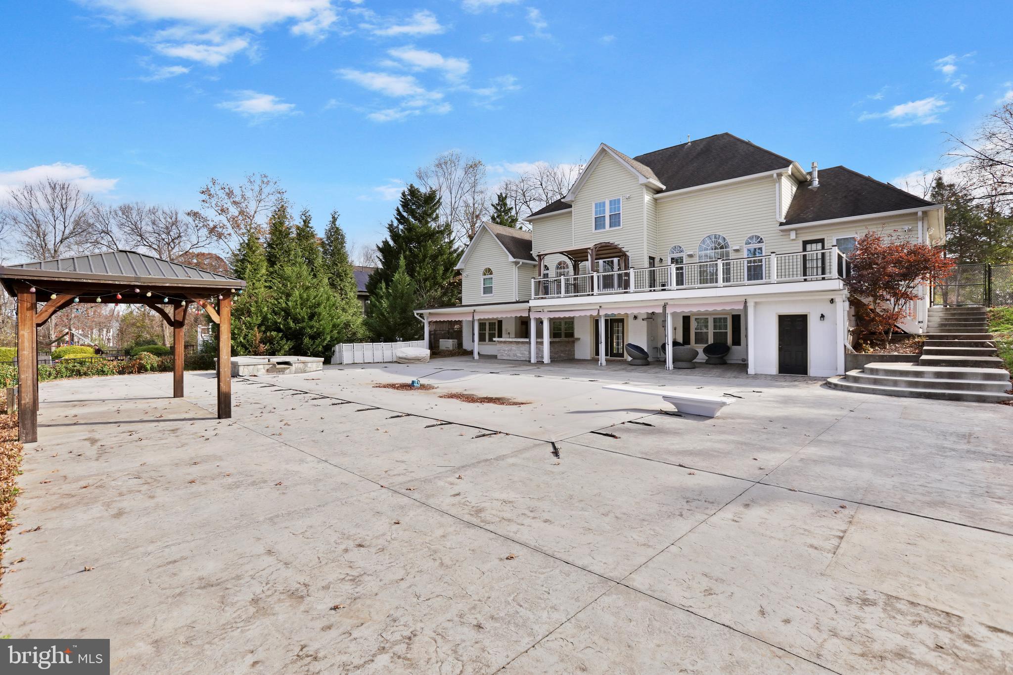 21490 Cedar Drive Sterling, VA 20164 - Photo 70 of 73 a view of a white house with a small yard and large trees