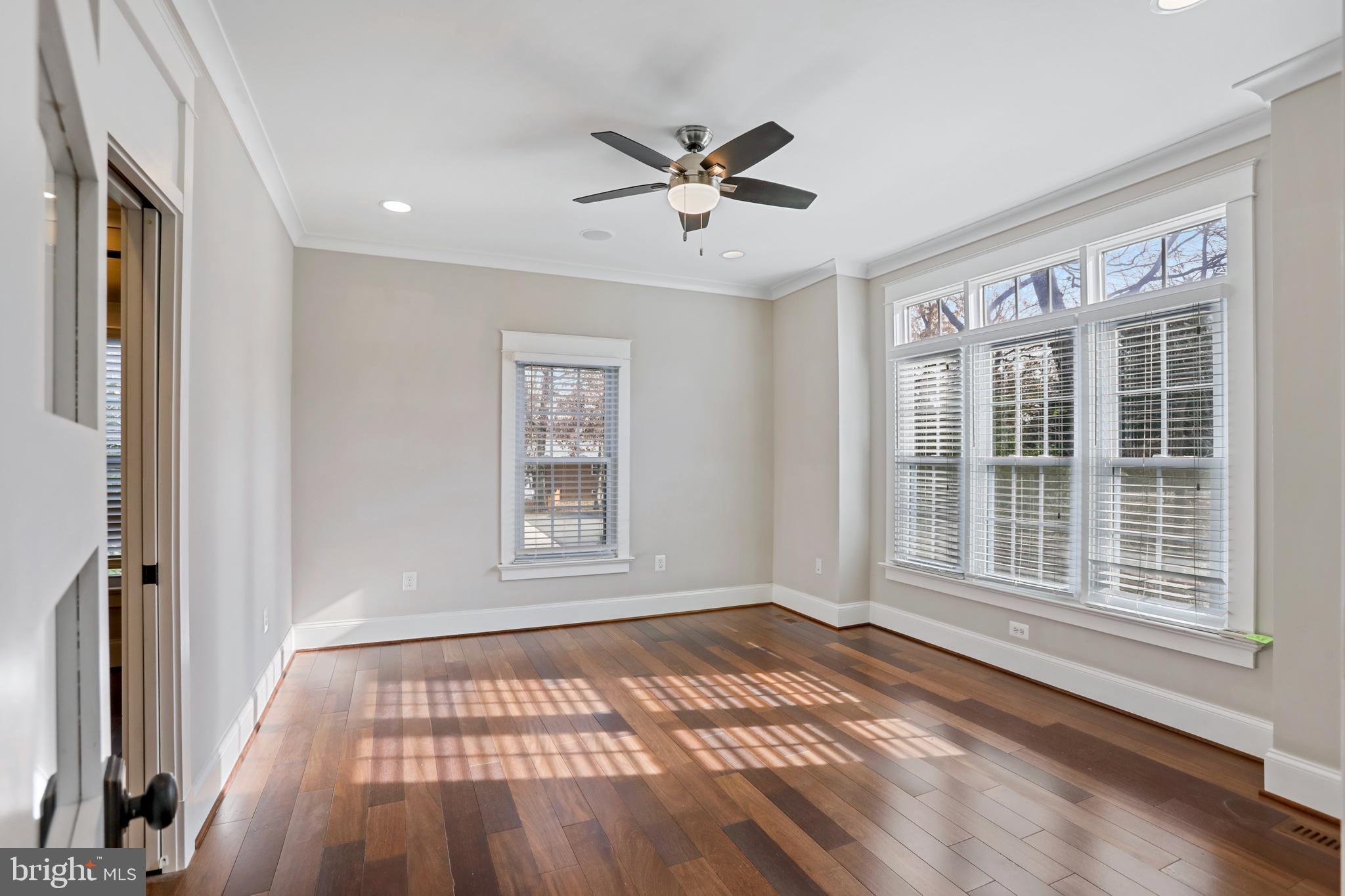 21490 Cedar Drive Sterling, VA 20164 - Photo 7 of 73 a view of an empty room with a window and wooden floor
