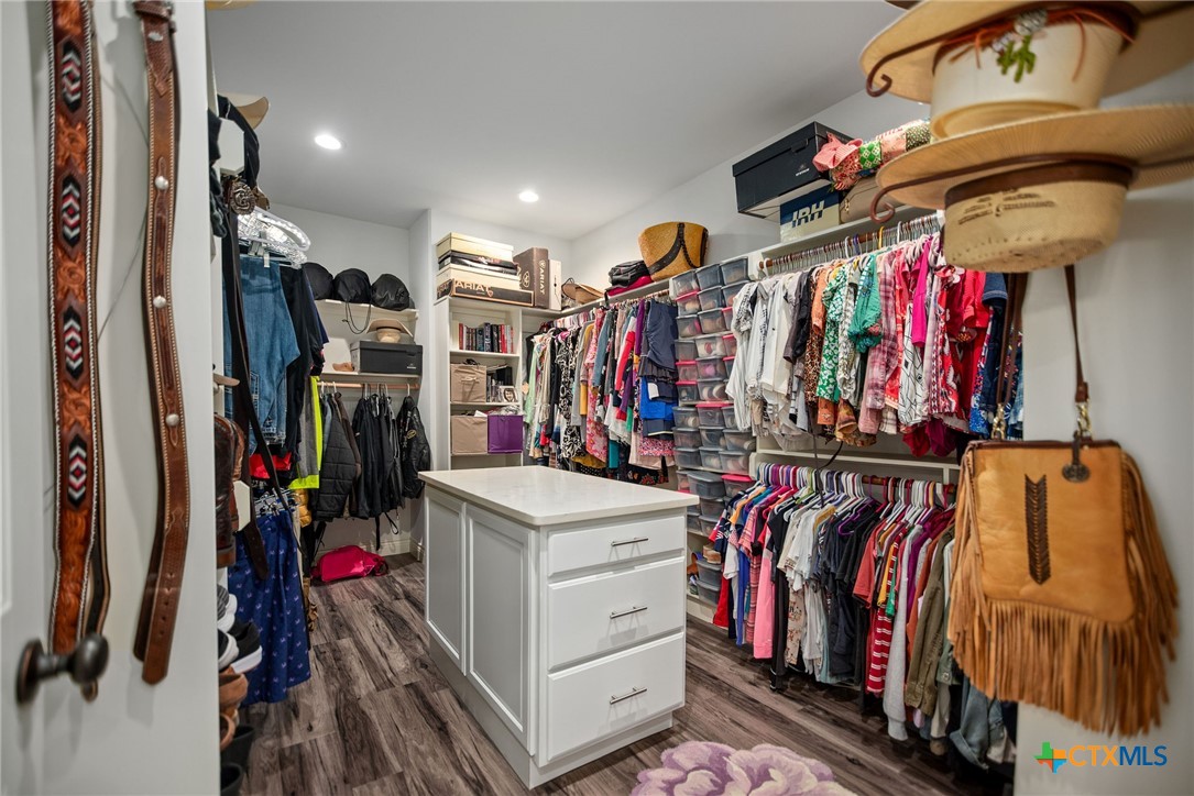437 Bischoff Road Inez, TX 77968 - Photo 24 of 47 a view of walk in closet with clothes