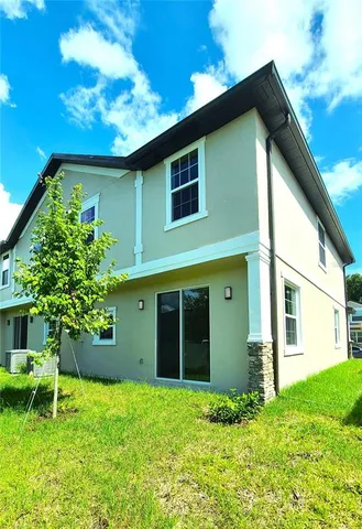 a house with a tree in front of it