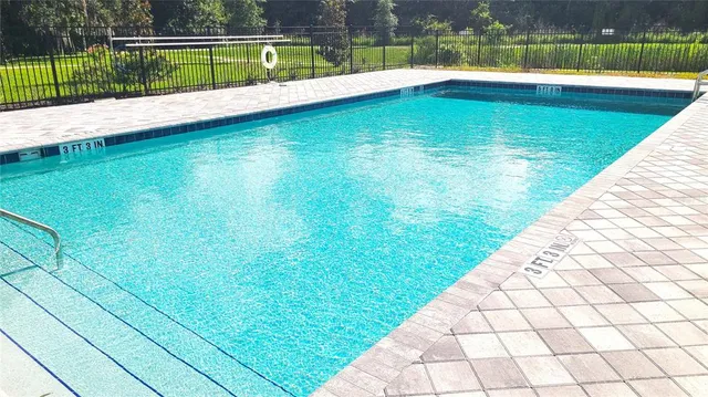 a view of swimming pool with a yard