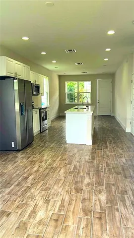 a view of a kitchen with a sink