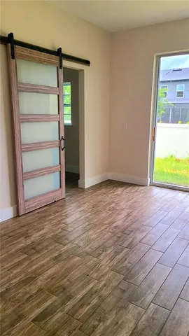 a view of an empty room with a window