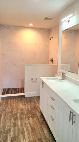 a bathroom with a sink and a mirror