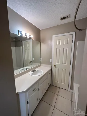 a bathroom with a sink double vanity and a mirror