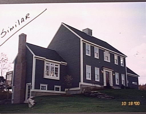 Lot 64 Boundary Stone Road Sutton, MA 01590 - Photo 1 of 1 a front view of a house with lake view and a window