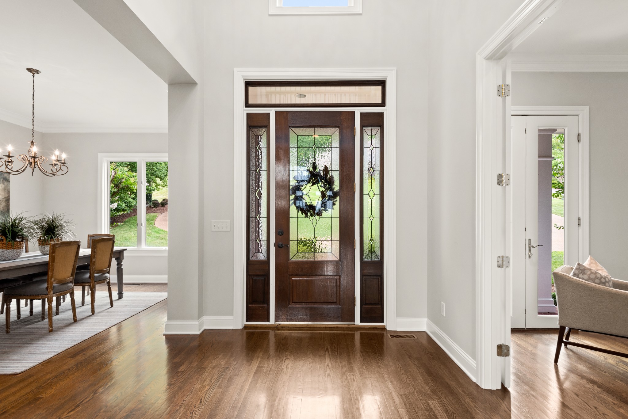 697 Legends Crest Drive Franklin, TN 37069 - Photo 2 of 26 a view of a hallway with wooden floor and dining room view