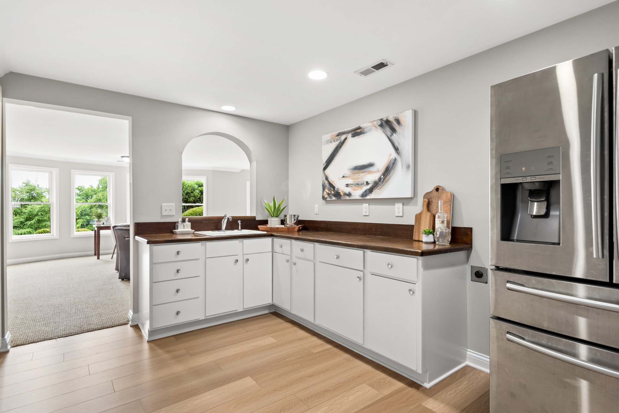 697 Legends Crest Drive Franklin, TN 37069 - Photo 19 of 26 a kitchen with cabinets a sink and a stove top oven