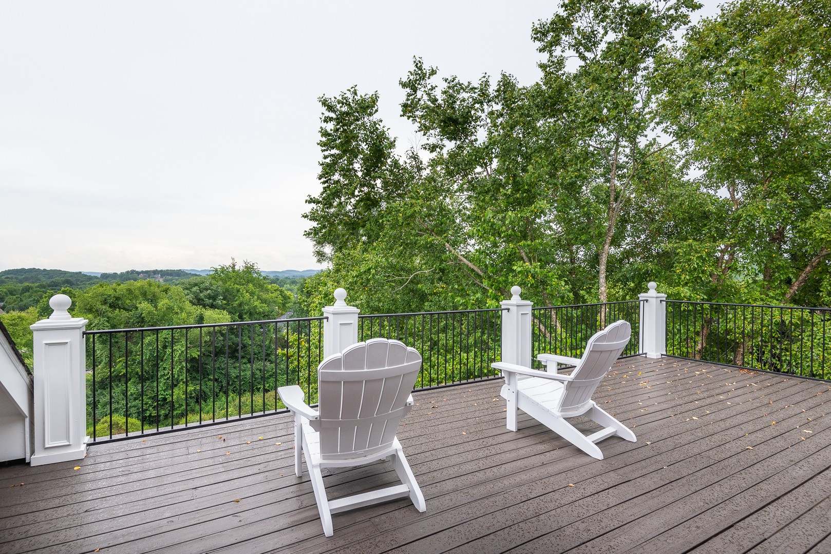 697 Legends Crest Drive Franklin, TN 37069 - Photo 22 of 26 a view of a chairs and table on the wooden deck