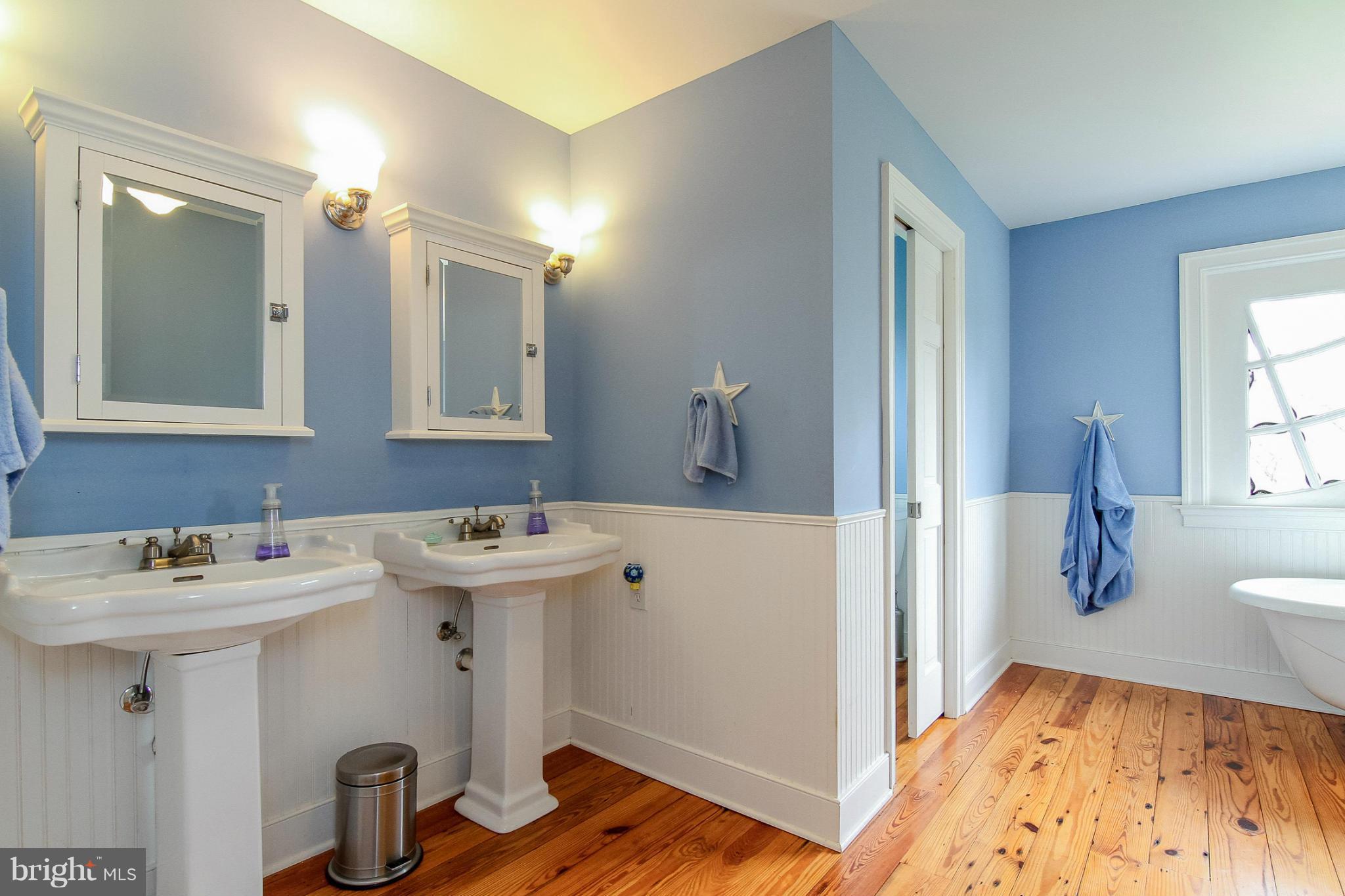 8735 Monumental Mills Road Rixeyville, VA 22737 - Photo 12 of 25 a view of a bathroom with a sink and mirror