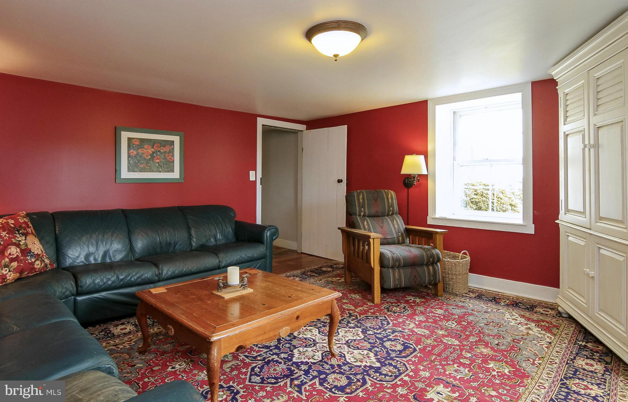 8735 Monumental Mills Road Rixeyville, VA 22737 - Photo 4 of 25 a living room with furniture and a window