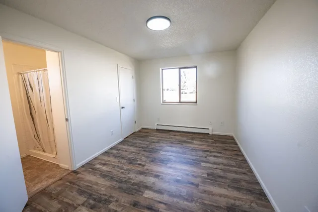 a view of bathroom with a toilet sink and mirror