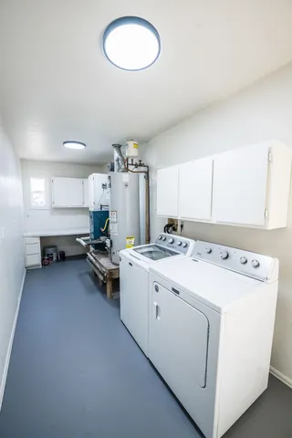 a bathroom with a toilet sink and shower