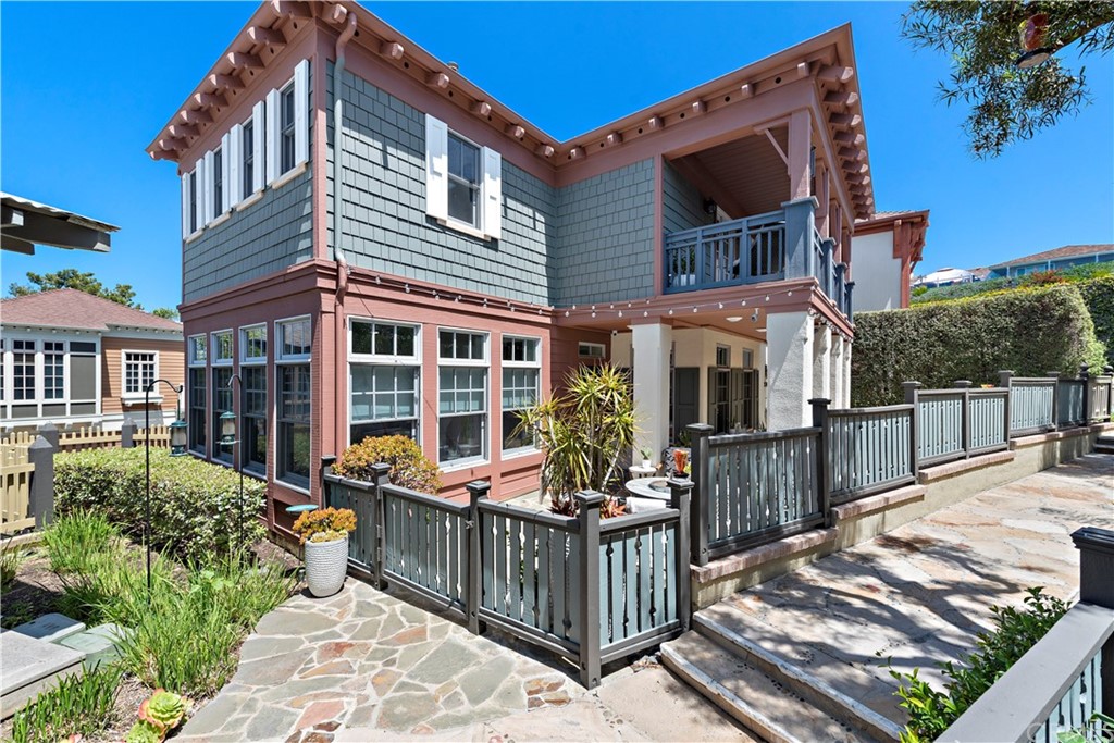 a front view of a house with large windows