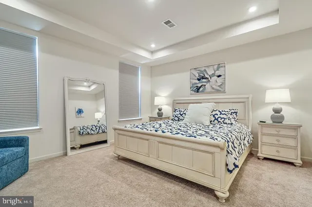 a room with a bed and a chandelier