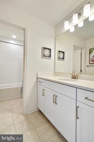 a bathroom with a sink a vanity and a mirror