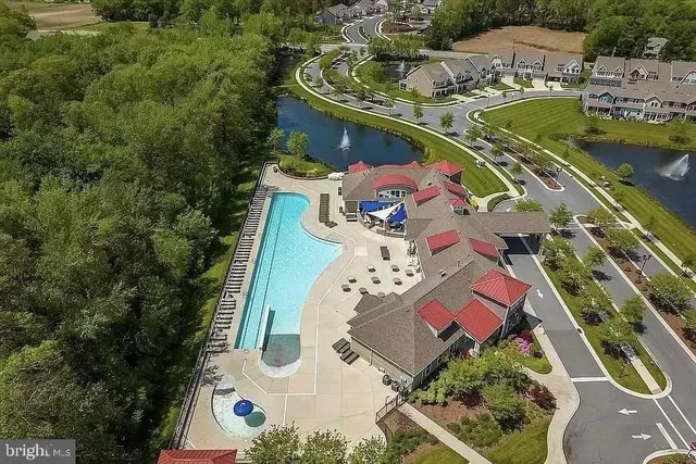 an aerial view of a house with a lake view
