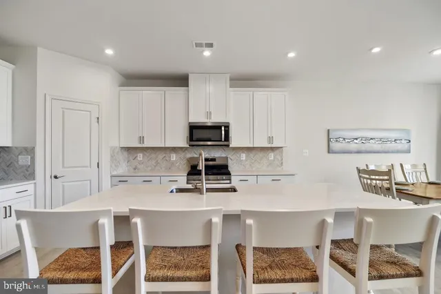 a kitchen with a sink cabinets and window
