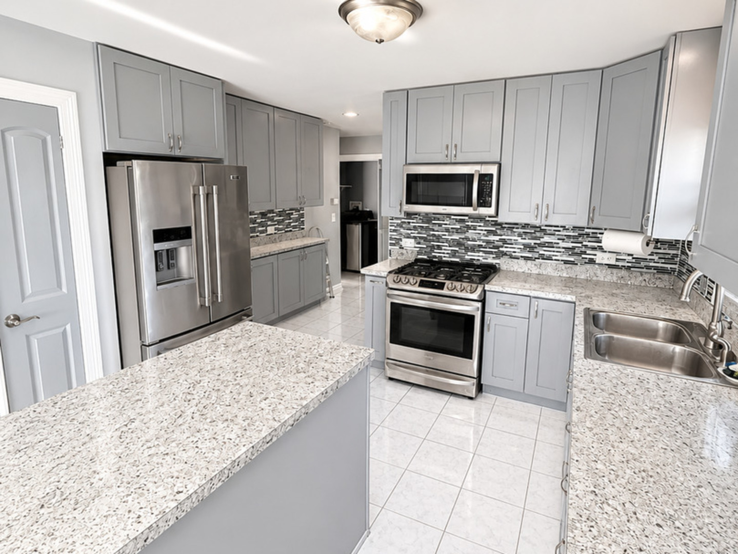 8356 South 78th Avenue Bridgeview, IL 60455 - Photo 15 of 39 a kitchen with granite countertop a stove sink and refrigerator