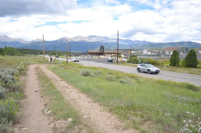a backyard of a house with lots of green space and plants