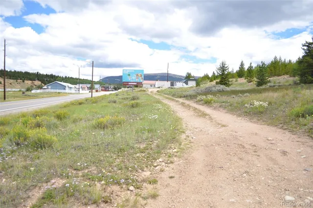 a view of a street with sitting area