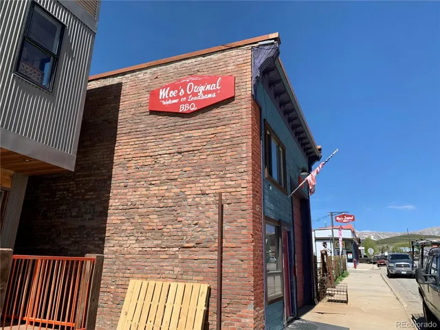 a view of street with sitting area