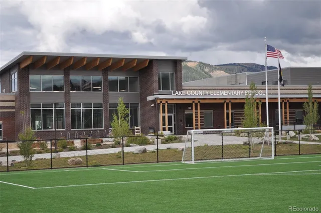 a view of a backyard with sitting area