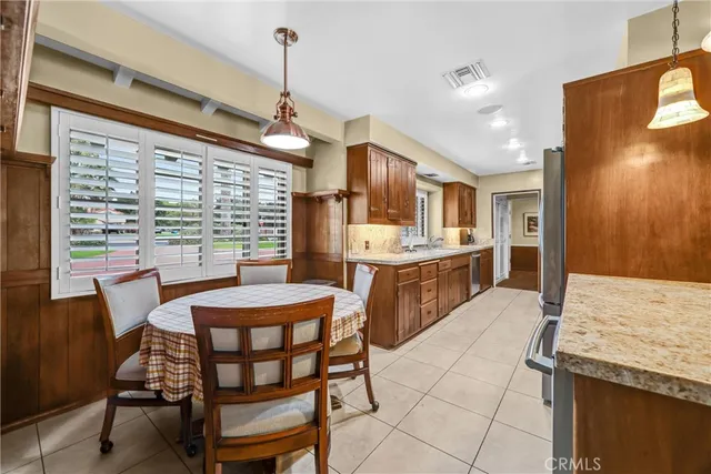 a dining room with furniture and window