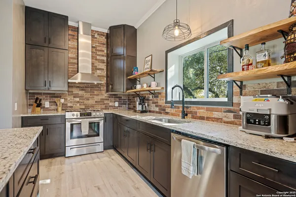 a bedroom with a large bed and a wooden floor