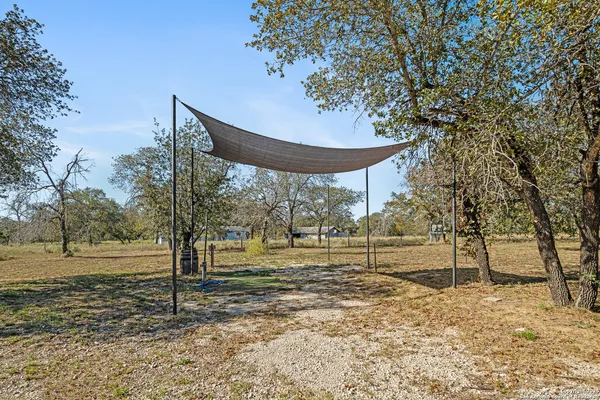 a view of a backyard with wooden floor