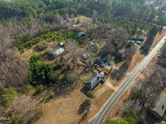 a view of a yard with a tree