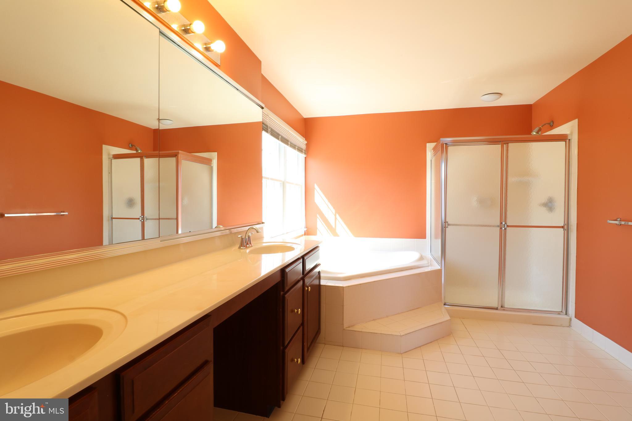 25497 Carrington Drive Chantilly, VA 20152 - Photo 18 of 41 a kitchen with a sink and a refrigerator