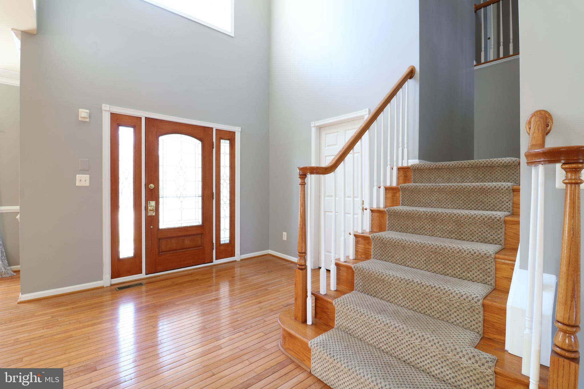 25497 Carrington Drive Chantilly, VA 20152 - Photo 2 of 41 a view of entryway and hall with wooden floor