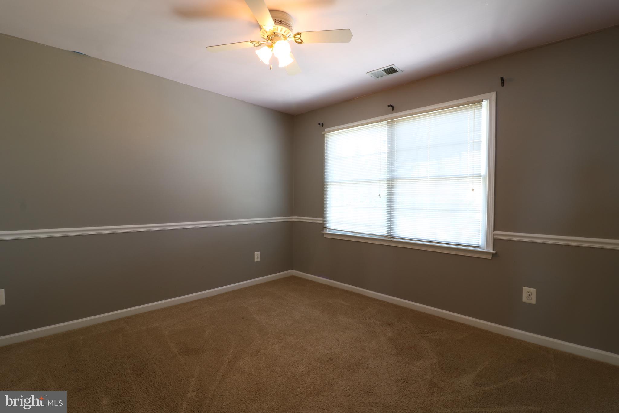 25497 Carrington Drive Chantilly, VA 20152 - Photo 28 of 41 en empty room with windows and fan