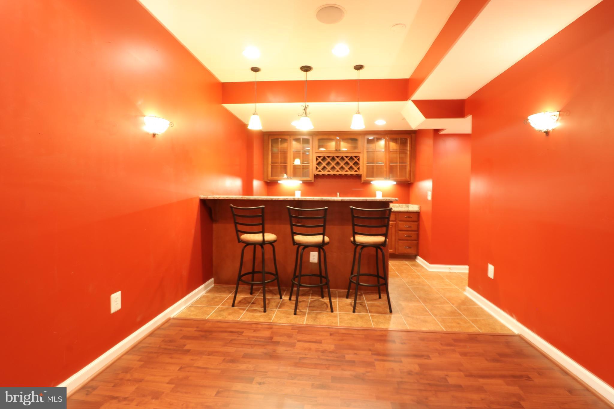 25497 Carrington Drive Chantilly, VA 20152 - Photo 32 of 41 a view of a patio with dining table and chairs with wooden floor