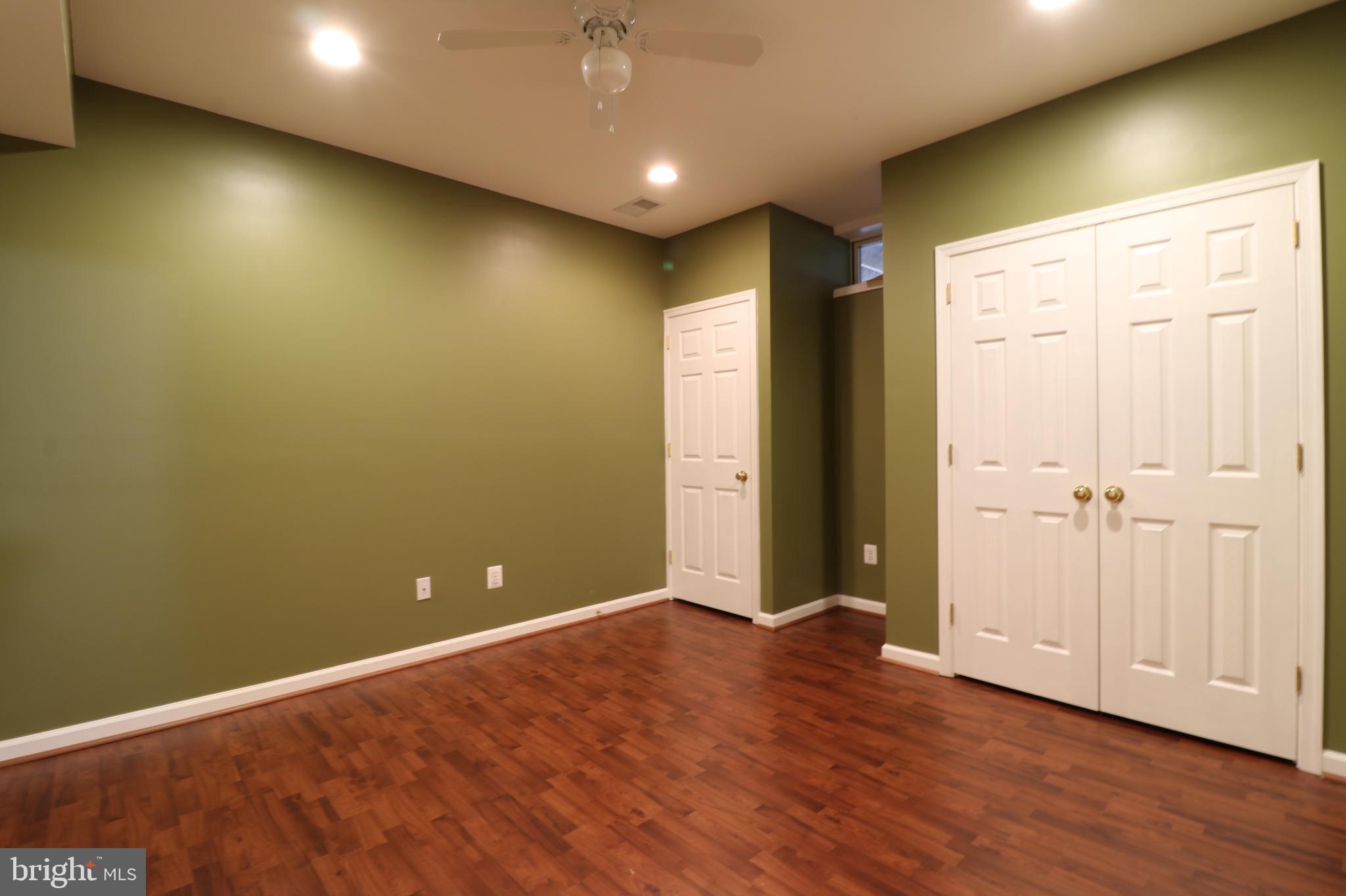25497 Carrington Drive Chantilly, VA 20152 - Photo 36 of 41 an empty room with wooden floor and windows