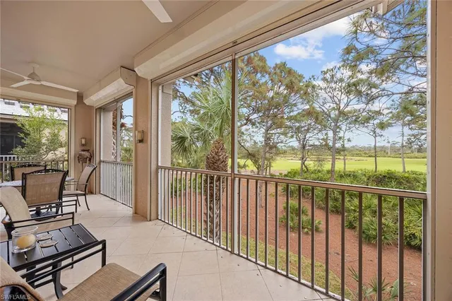 a view of a chairs and tables in the balcony