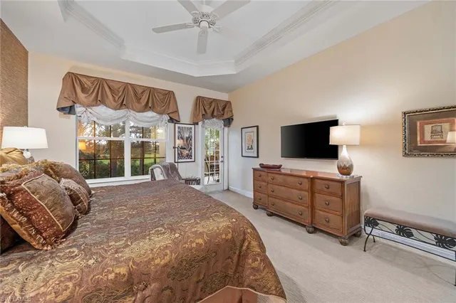 a bedroom with a bed and flat screen tv