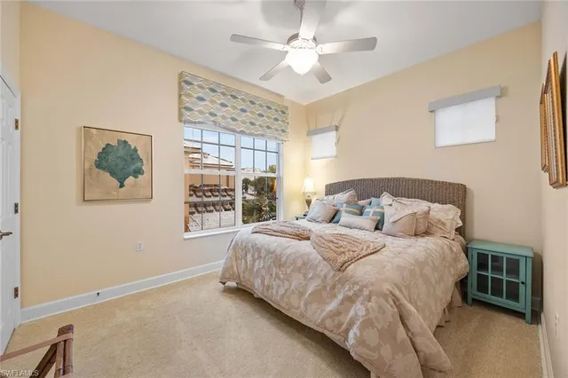 a spacious bedroom with a bed and a window