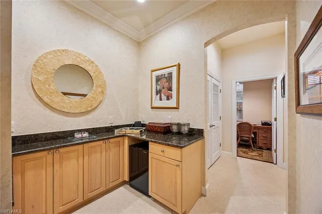 a kitchen with a sink and a stove top oven