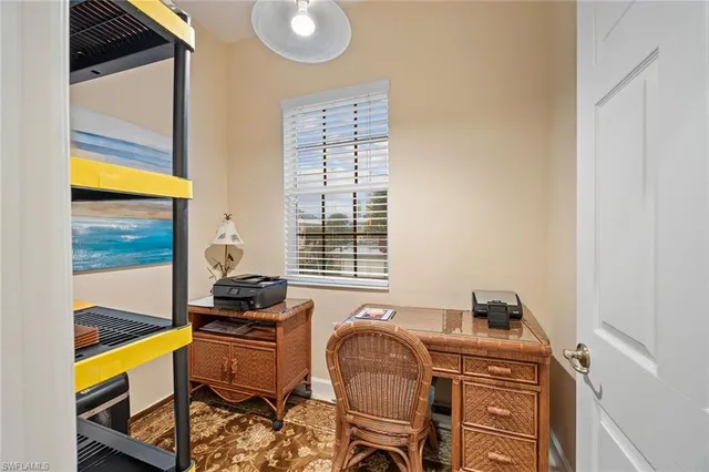 a dining room with furniture and a window
