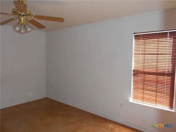 a view of a window in an empty room