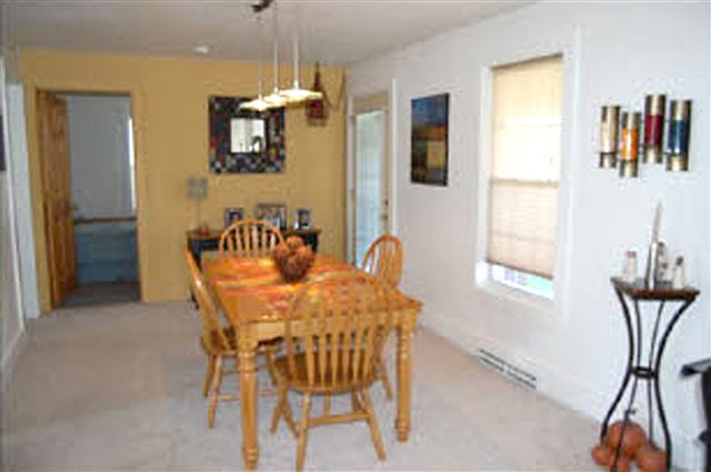 11323 West Montague Road Baileyville, IL 61007 - Photo 3 of 9 a view of a dining room with furniture and a window