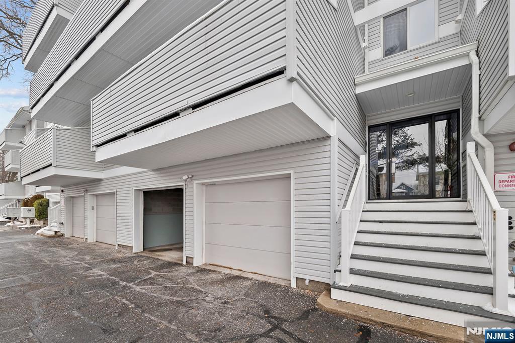 142 Main Avenue, Unit 4A Passaic, NJ 07055 - Photo 2 of 26 a view of a house with a garage