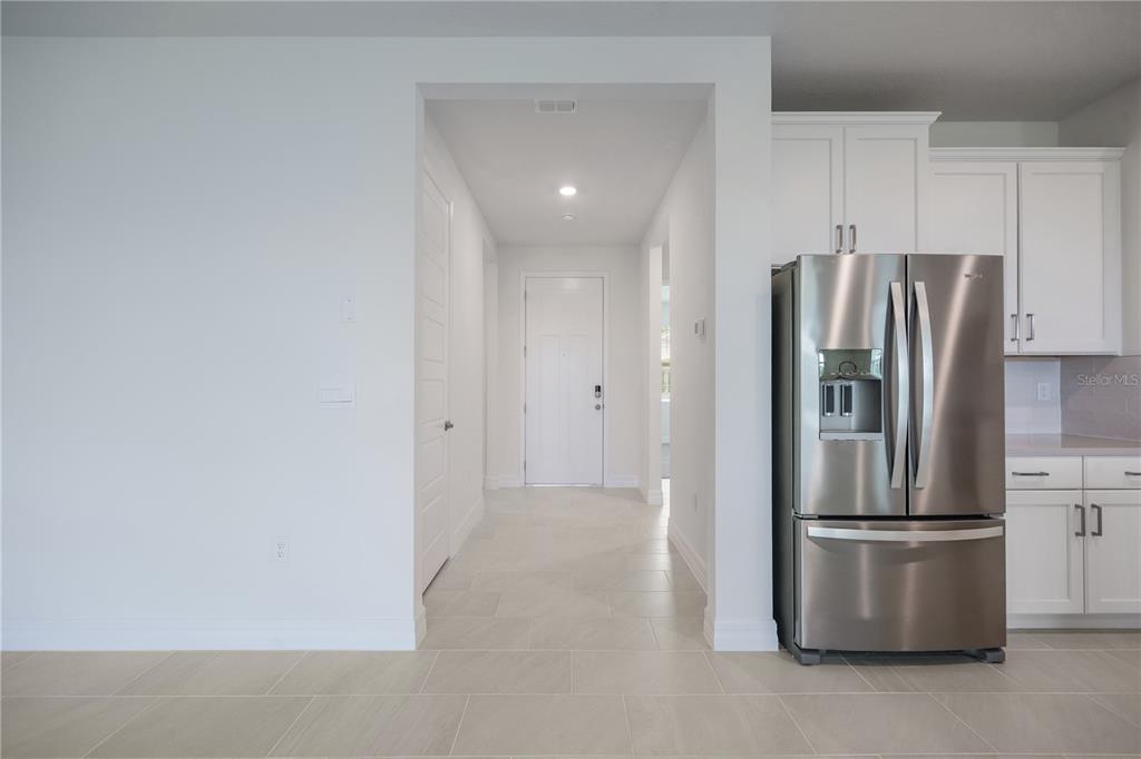 3944 Kennebunk Loop Mount Dora, FL 32757 - Photo 16 of 32 a metallic refrigerator freezer sitting in a kitchen