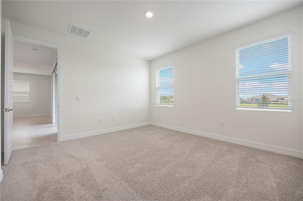 3944 Kennebunk Loop Mount Dora, FL 32757 - Photo 19 of 32 an empty room with windows and closet